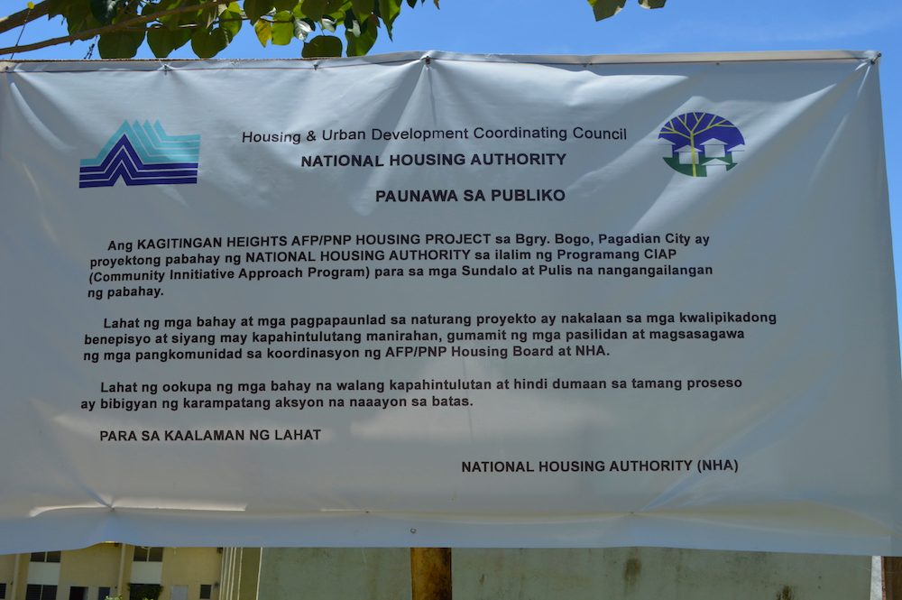 NOTICE. NHA-Pagadian personnel installed a notice to prevent unauthorized takeover of the housing units at Kagitingan Heights. Photo by Gualberto Laput/Rappler 