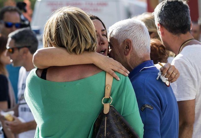 ANGUISH. Survivors cry in Amatrice, central Italy, where a 6.1 earthquake struck August 24, 2016. Massimo Percossi/EPA 