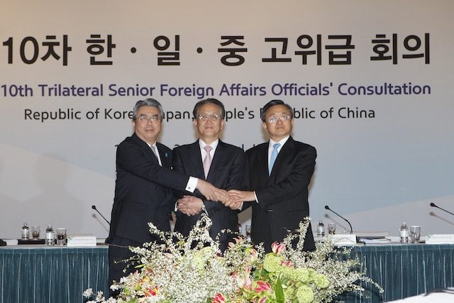 South Korea, China, Japan seek to ease tensions, set up FM meet