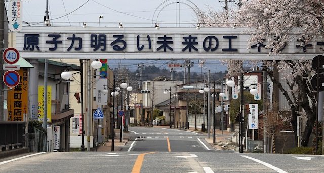 Deserted Fukushima town to remove pro-nuclear signs