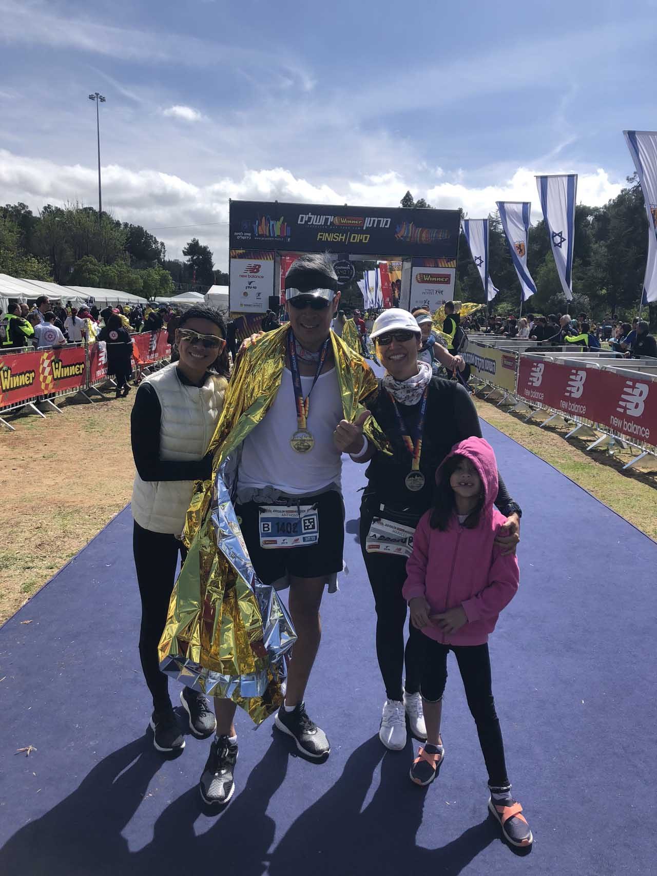 FINISH LINE. Anthony and Maricel Pangilinan with their two daughters Ella and Solana after the marathon.  