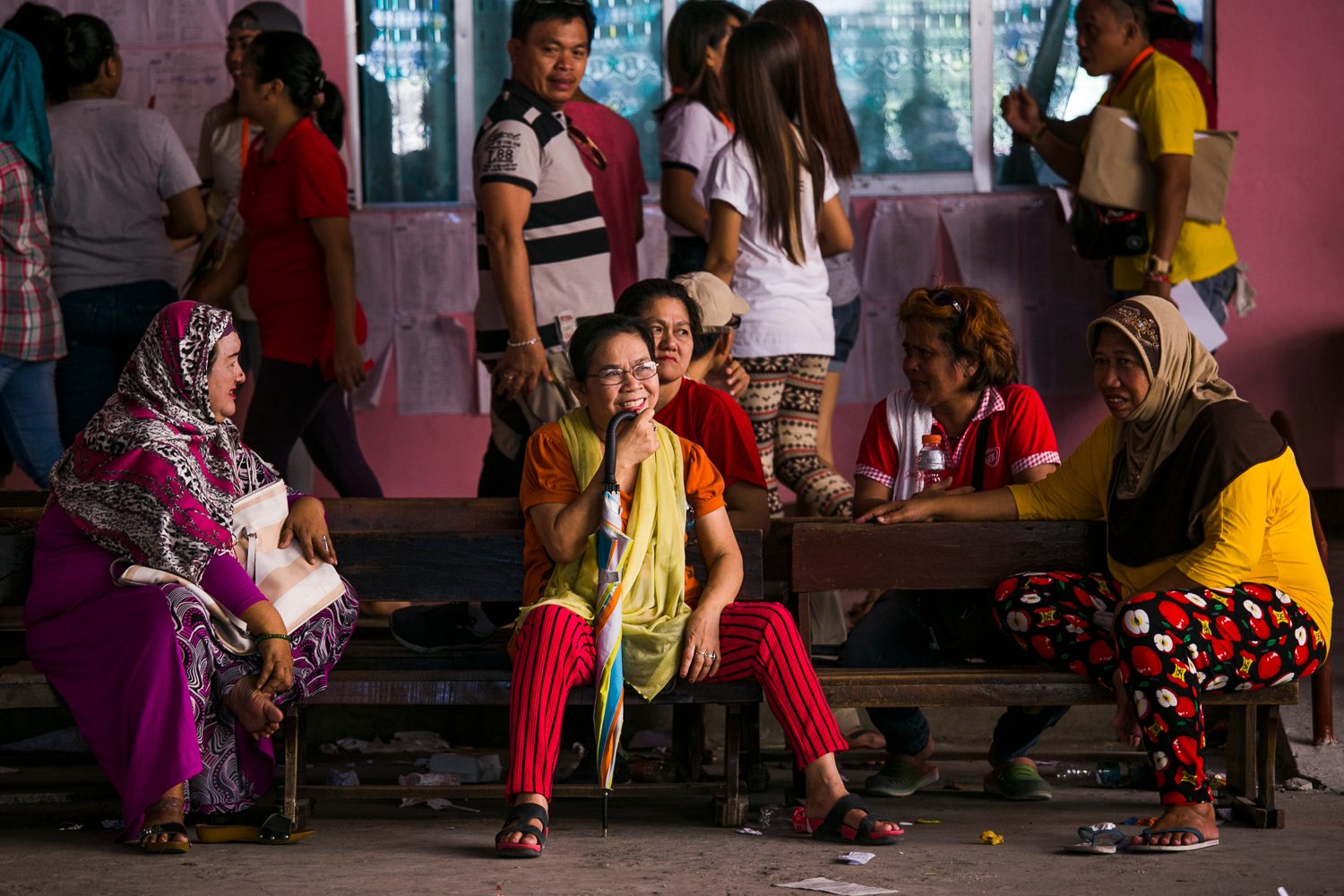 WAITING FOR THEIR TURN. Women wait in the open area of Maharlika Elementary school located in a predominantly Muslim community. Photo by Pat Nabong/Rappler 