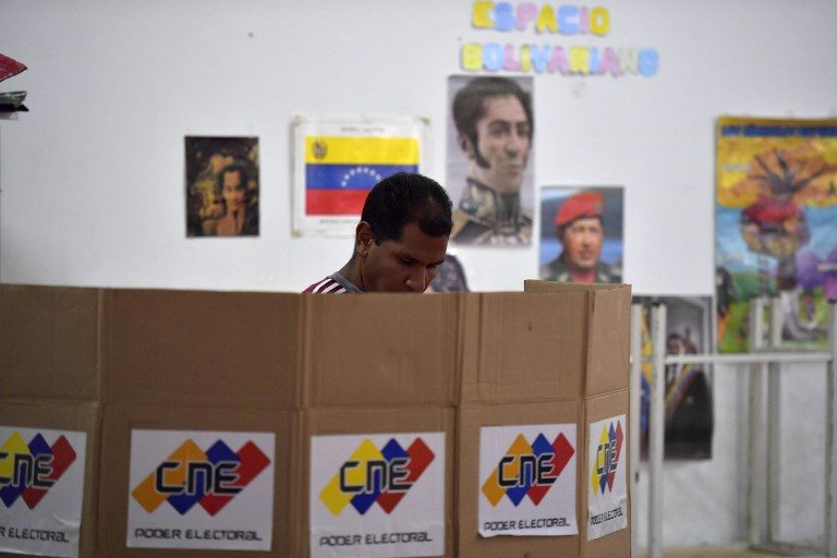 Weary Venezuelans go to polls with record low turnout predicted