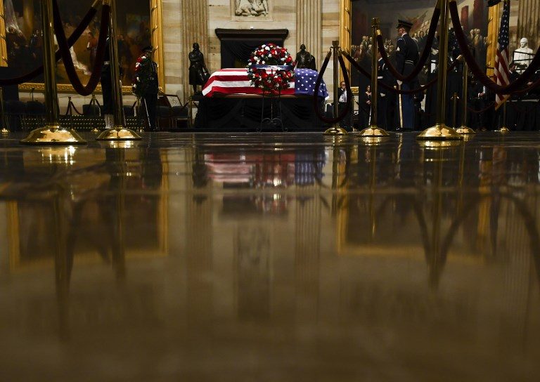 Trump pays respects as president Bush lies in state in U.S. Capitol