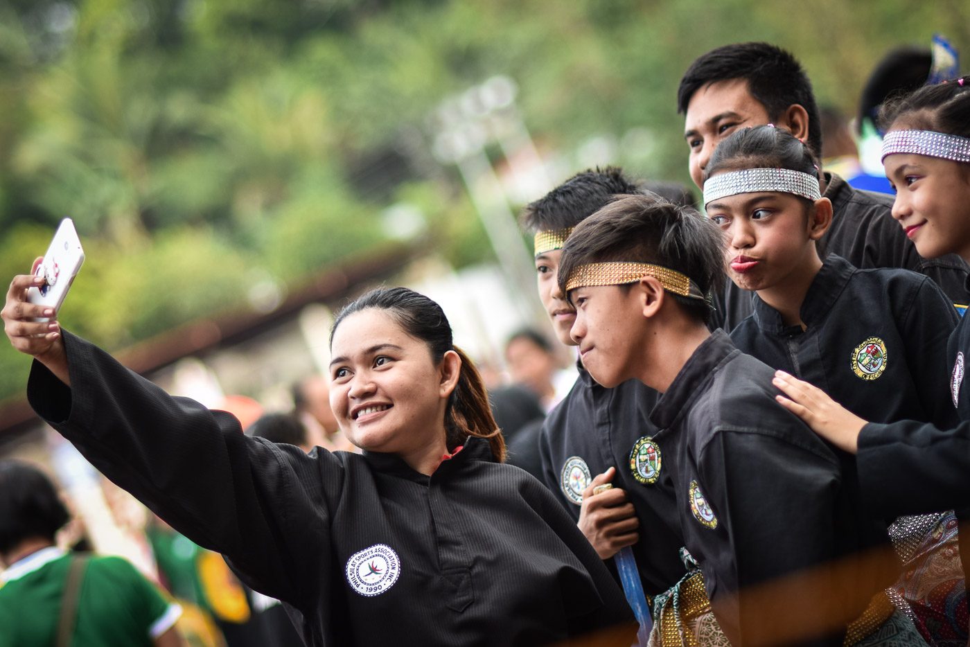 SMILE. Pencak Silat student-athletes from Zamboanga takes a selfie prior to the start of competitions. Photo by LeAnne Jazul/Rappler 