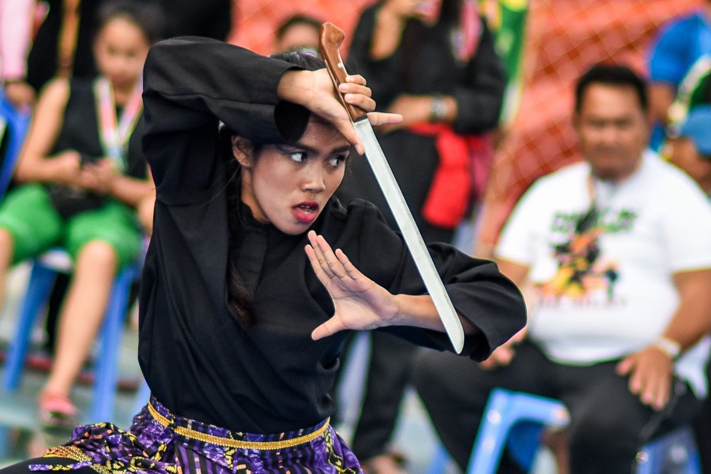 FIERCE. A Pencak Silat competitor from Iloilo shows her game face during the event at the EBJ Sports Stadium in San Jose. Photo by LeAnne Jazul/Rappler  