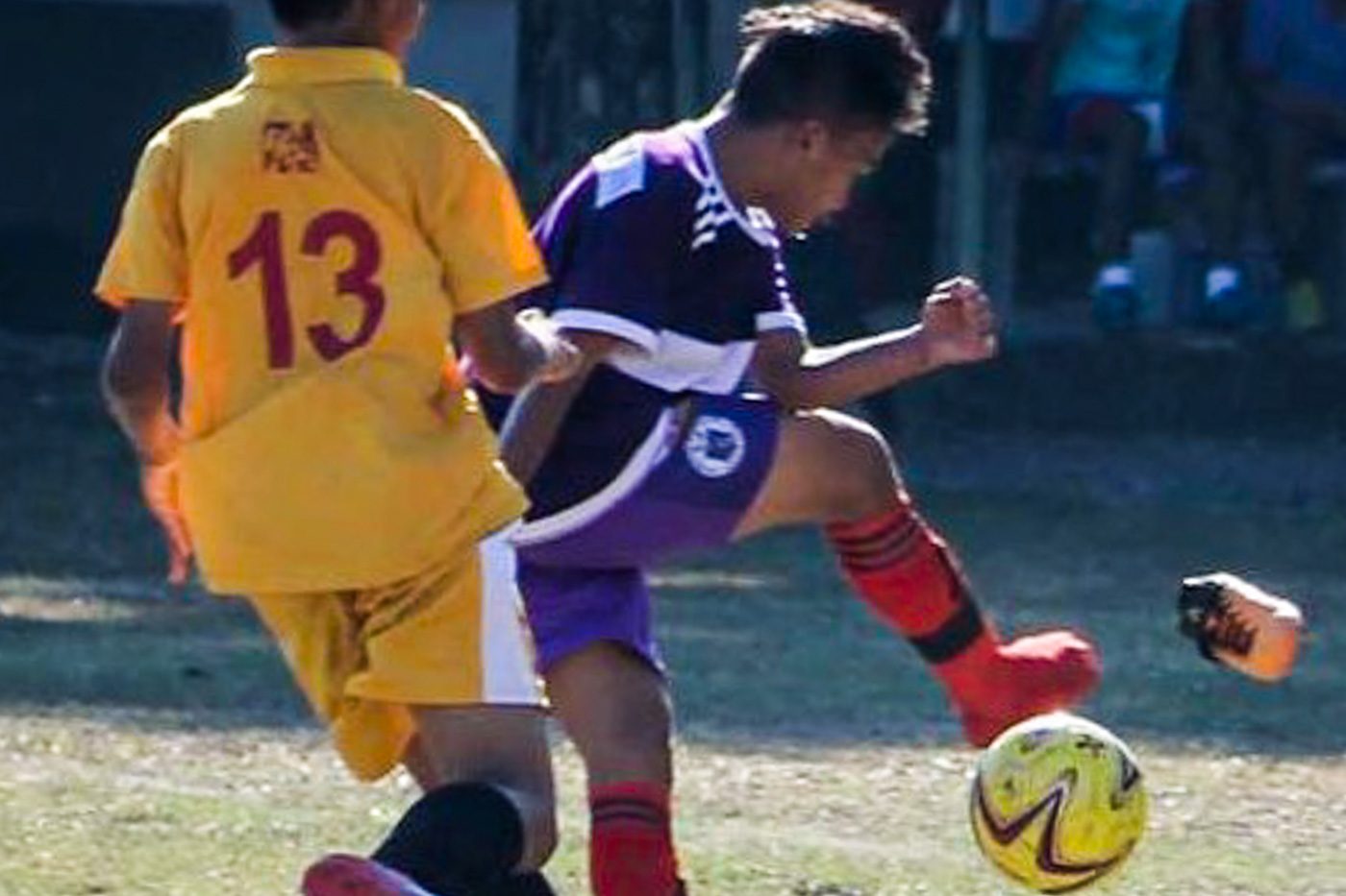 STRIKER. A booter from Soksargen (SRAA) loses his shoe during a Football match against Region I. Photo by Reyman Rusty Jayme/ Rappler 