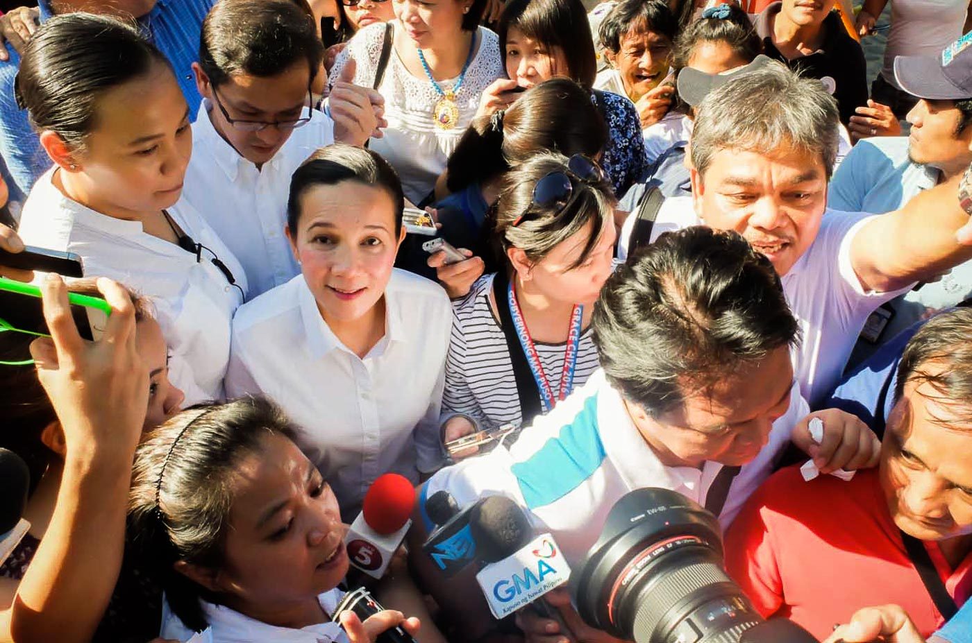 TIGHTLY GUARDED. Sen. Grace Poe after speaking in a rally on International Women's Day at Liwasang Bonifacio, Manila.  