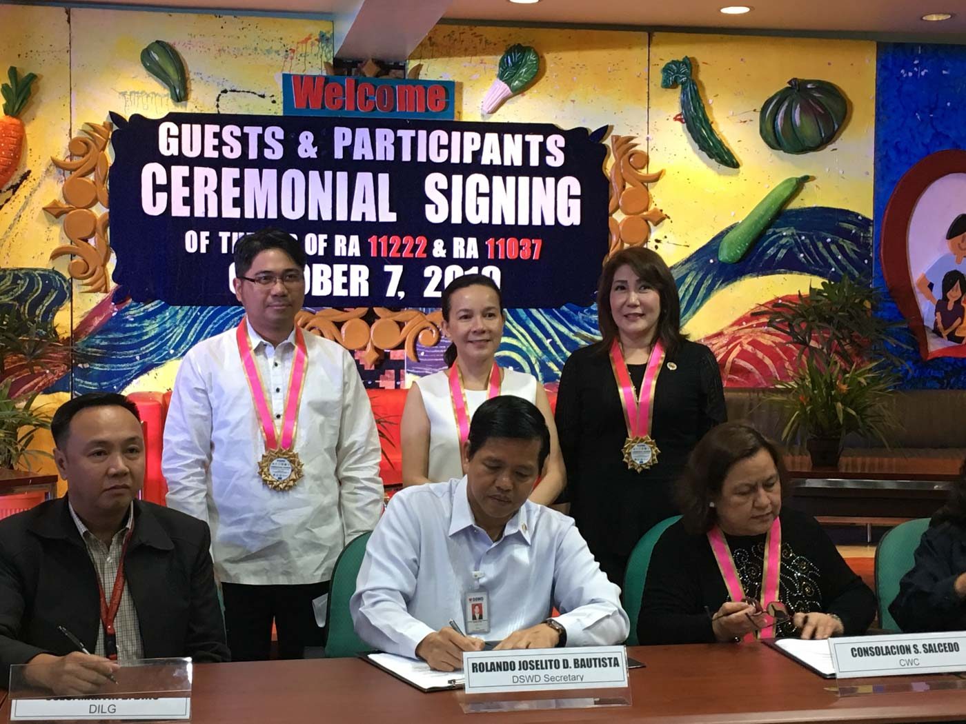 DSWD signs implementing rules for laws on adoption, gov’t feeding programs