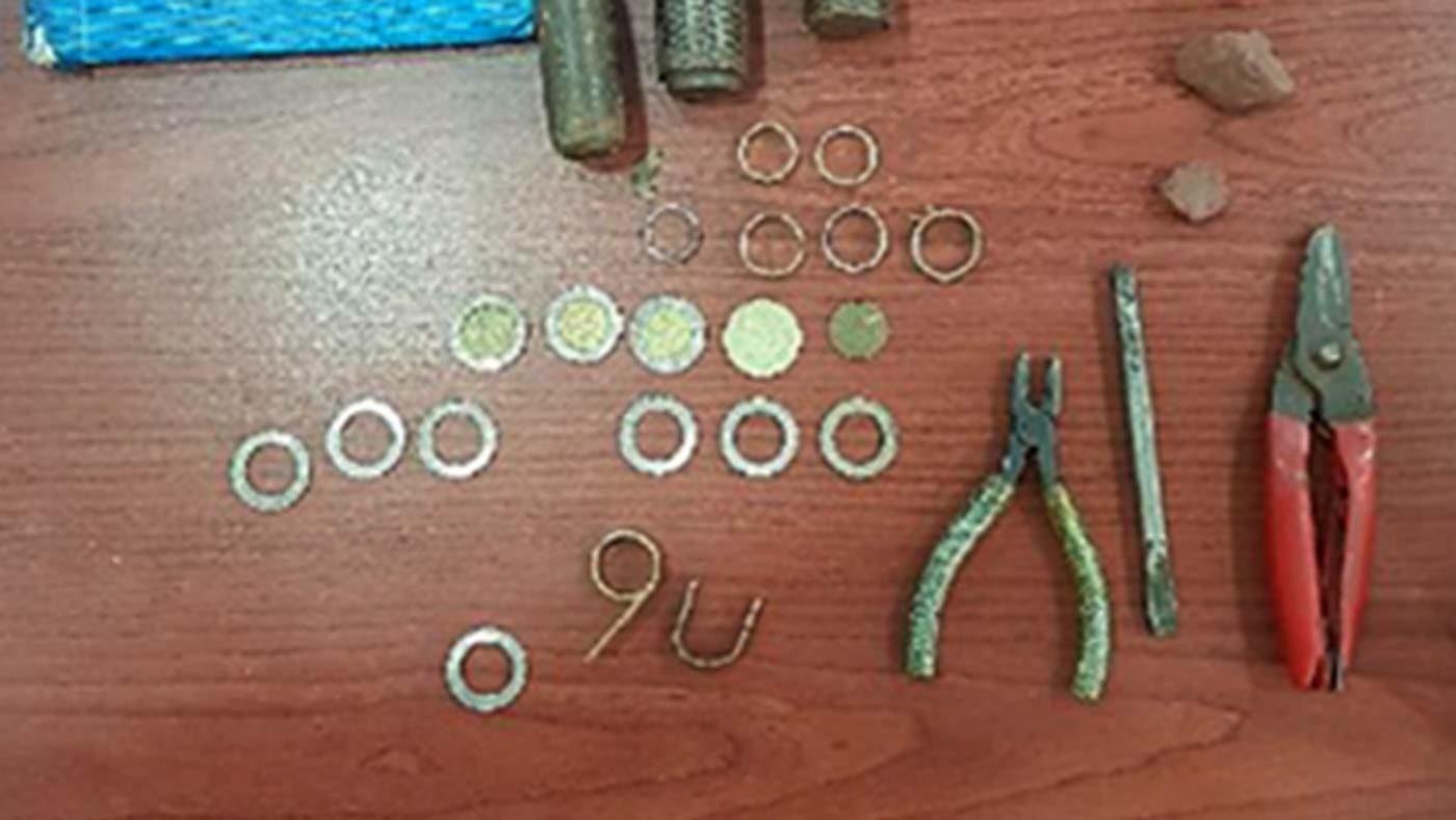 EVIDENCE. The suspects' tools are seized along with the mutilated coins. Photo from the Bangko Sentral ng Pilipinas 