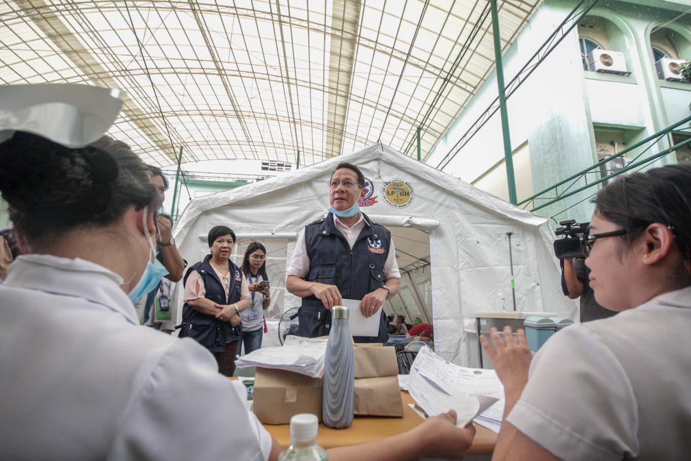 EXTRA MEASURES. Department of Health Secretary Francisco Duque inspects tents set up for measles patients at San Lazaro Hospital in Manila on February 13, 2019. Photo by Lito Borras/Rappler  