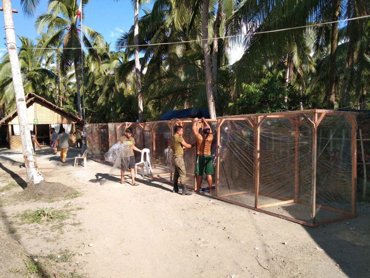 SANTIZING CHAMBER. Soldiers of Philippine Army build sanitizing chambers for frontliners in quarantine checkpoints. Photo courtesy of 63rd Infantry Battalion, Philippine Army   