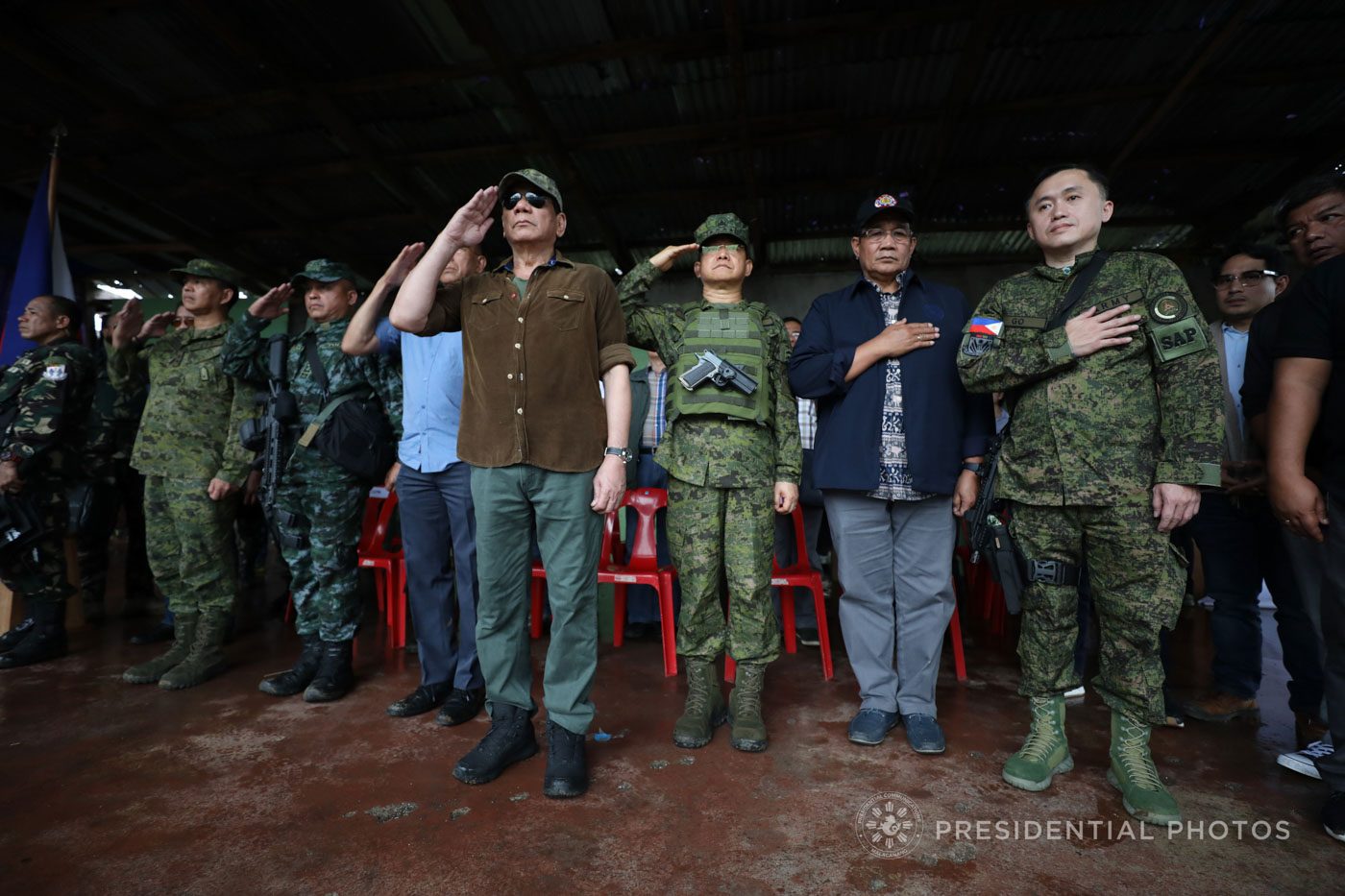 DUYAN KA NG MAGITING. President Rodrigo Duterte and other government officials salute as the Philippine national anthem is played for the first time in 'liberated' Marawi City on October 17, 2017.  Photo by Malacañang   