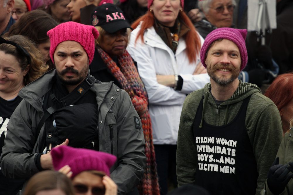 It wasn't just women who were wearing the 'pussyhats.' Here are some men attending the rally wearing them. 