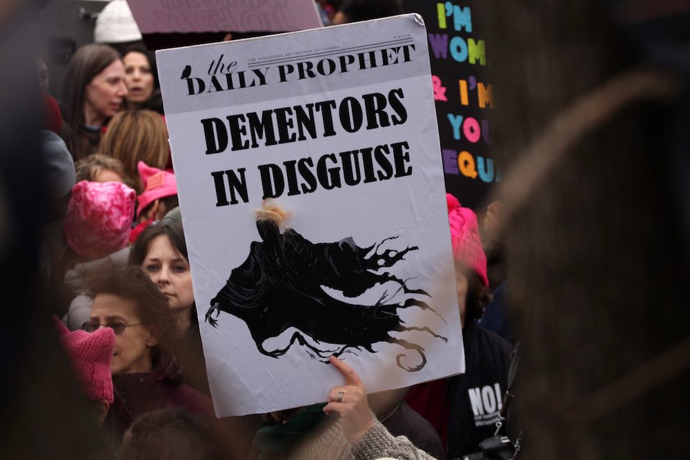 From Azkaban to the White House: Pop culture references, like this about Harry Potter, abound in protesters' placards. 