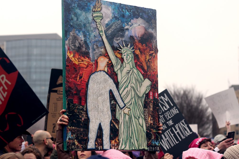 Protestors were very creative with their signs. This one depicts the US President Donald Trump having his way with Lady Liberty as the New York skyline burns in the background.
Santiago J. Arnaiz 
