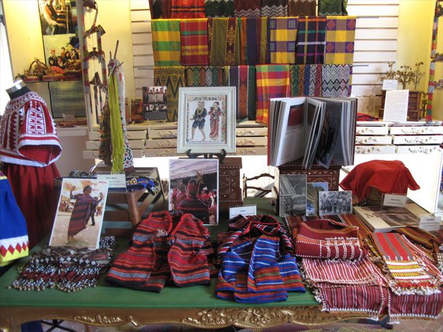 MULTI-CULTURAL DISPLAY.  Examples of dress from ethnolinguistic groups in Mindanao and Northern Cordillera flank a replica of an illustration from the 'Boxer Codex,' a manuscript from c.1595 containing detailed drawings of various ethnolinguistic groups in the Philippines and other cultural groups in Asia.