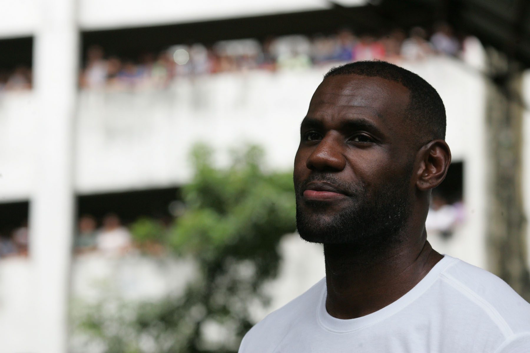 HAPPY. LeBron James looks happy and inspired seeing the kids who love basketball at the tenement. Photo by Josh Albelda/Rappler 