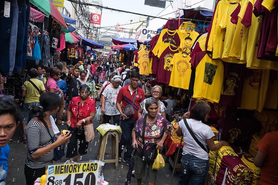 ENTERPRISING. Stalls that do not normally sell religious items during other months of the year take advantage of the demand for Nazareno-related items, like lining their stalls with religious-themed T-shirts. 