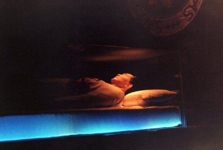 PUBLIC. The embalmed body of Ferdinand Marcos is seen through a sealed glass coffin inside a dimly lighted mausoleum in his northern Philippine hometown on September 11, 1993. Photo by Romeo Gacad/AFP 