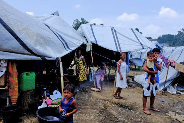 DISPLACED. Internally displaced Lumad outside their tent in the Tandag city sports center evacuation center. Photo by Bobby Lagsa / Rappler   
