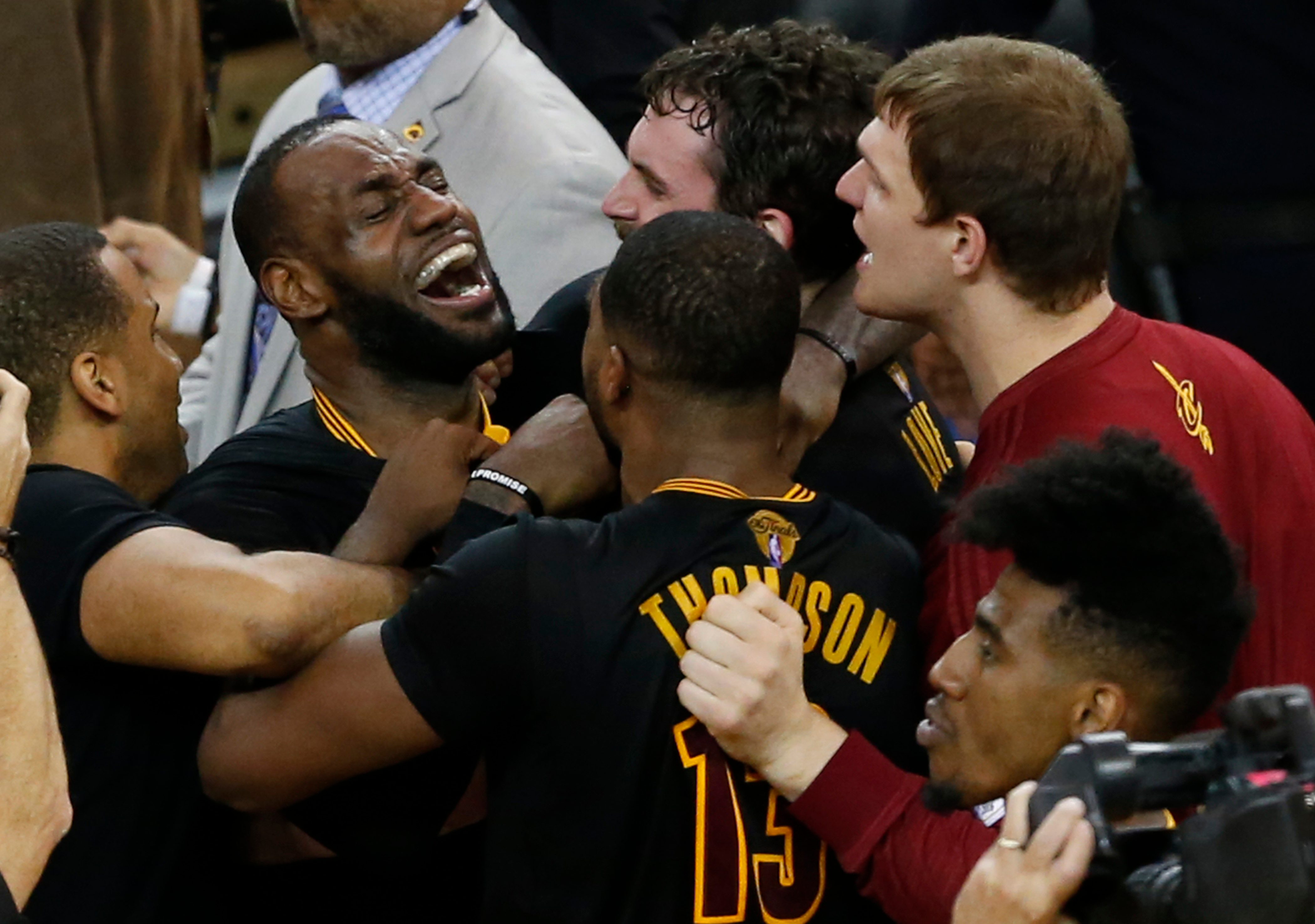 WINNING MOMENT. Cleveland Cavaliers players LeBron James (L), Tristan Thompson (C) and Kevin Love (R) celebrate after the final buzzer. JOHN G. MABANGLO CORBIS OUT/EPA 