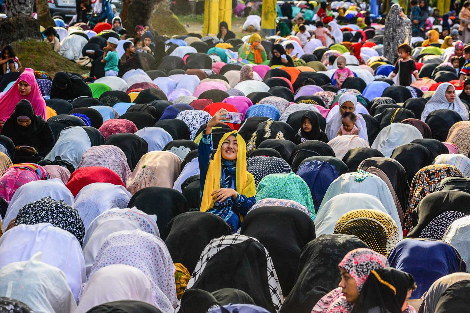 OBLIGATORY. A Muslim women takes a selfie before praying during the Eid'l Fitr celebration at the Blue Mosque in Taguig City. Photo by Maria Tan/Rappler 