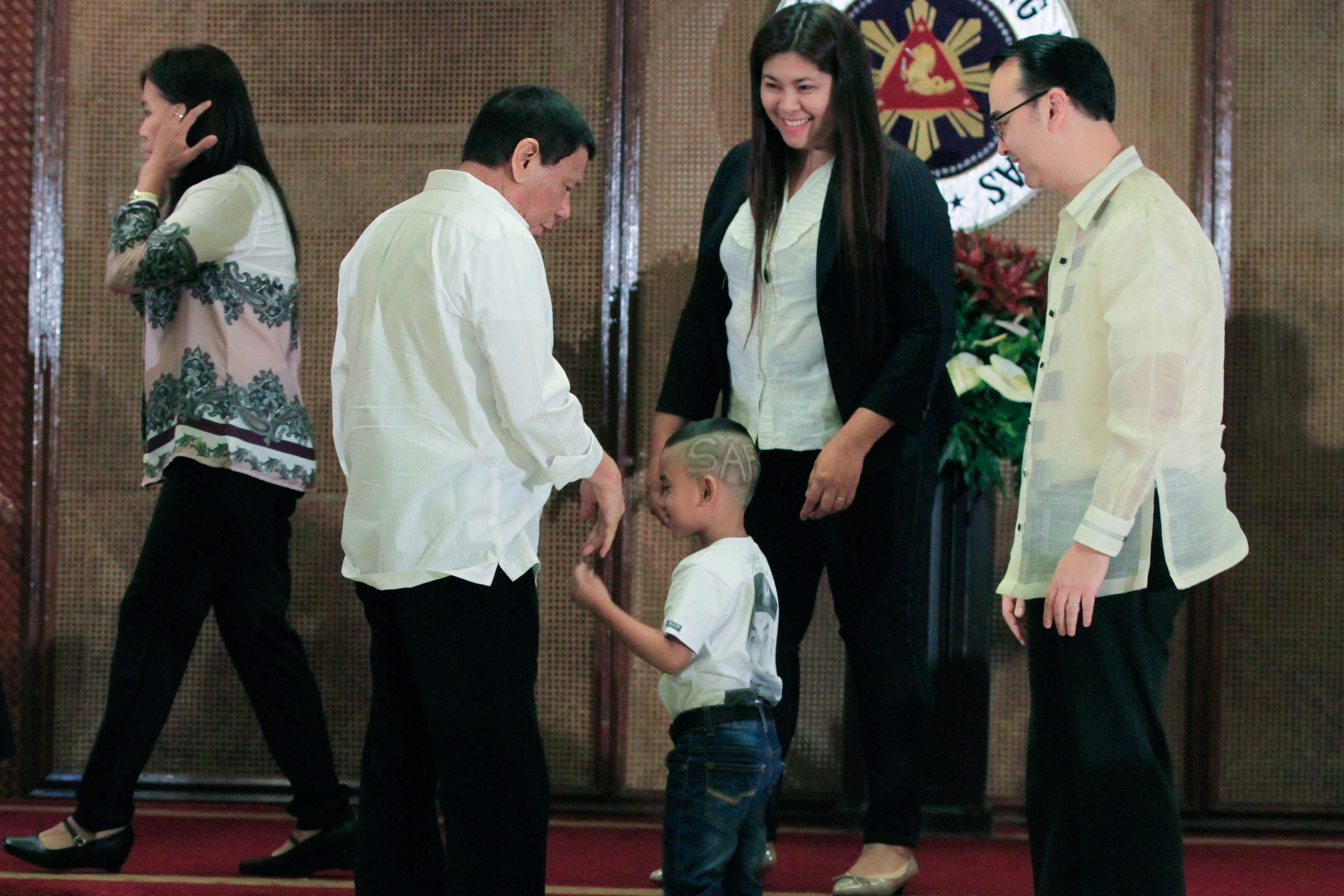 'MANO PO.' President Rodrigo Duterte meets the family of a fallen Special Action Force trooper. Photo by Rolando Mailo/Presidential Photo  