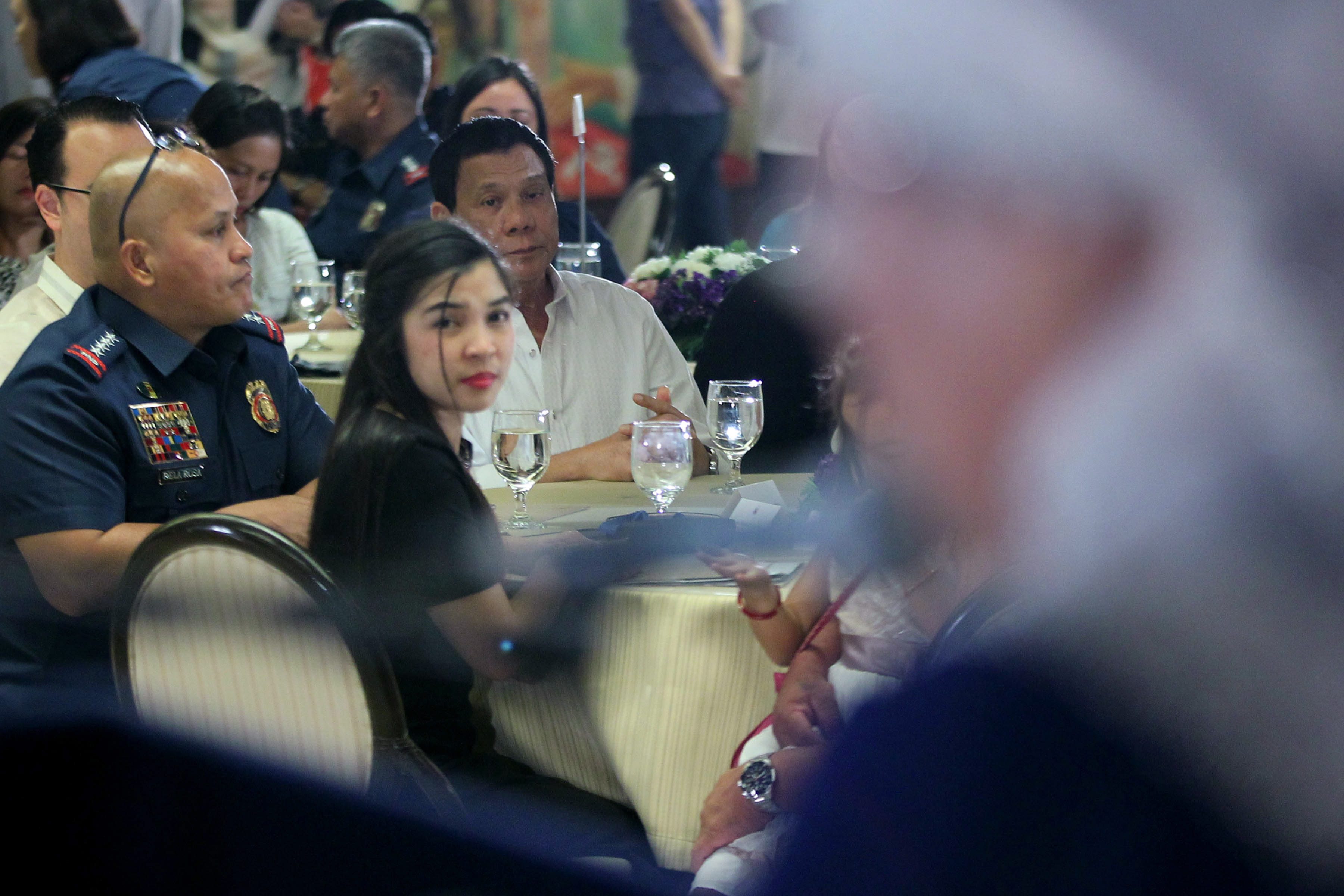 MOTHER'S MESSAGE. The mother of one of the SAF 44 gives a message as President Rodrigo Duterte, PNP chief Ronald dela Rosa, and other families listen. Photo by Ace Morandante/Presidential Photo  