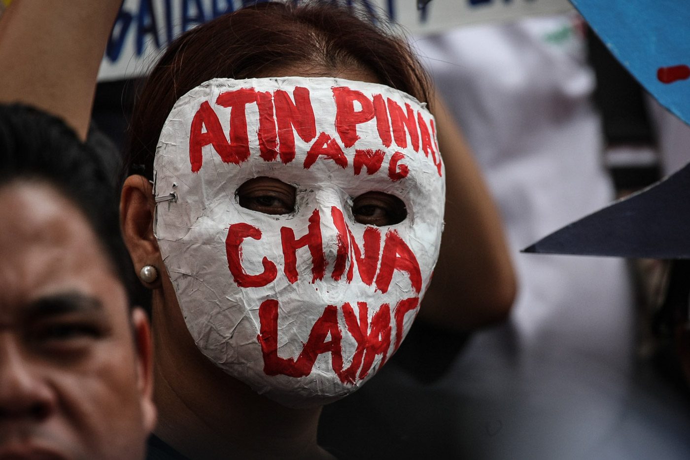 MASK. A man wears a mask with the words "Atin ang Pinas. China layas" during a protest at the Chinese Consulate on the day of Xi Jinping's state visit to the Philippines on Tuesday, November 20, 2018. Photo by Jire Carreon/Rappler 