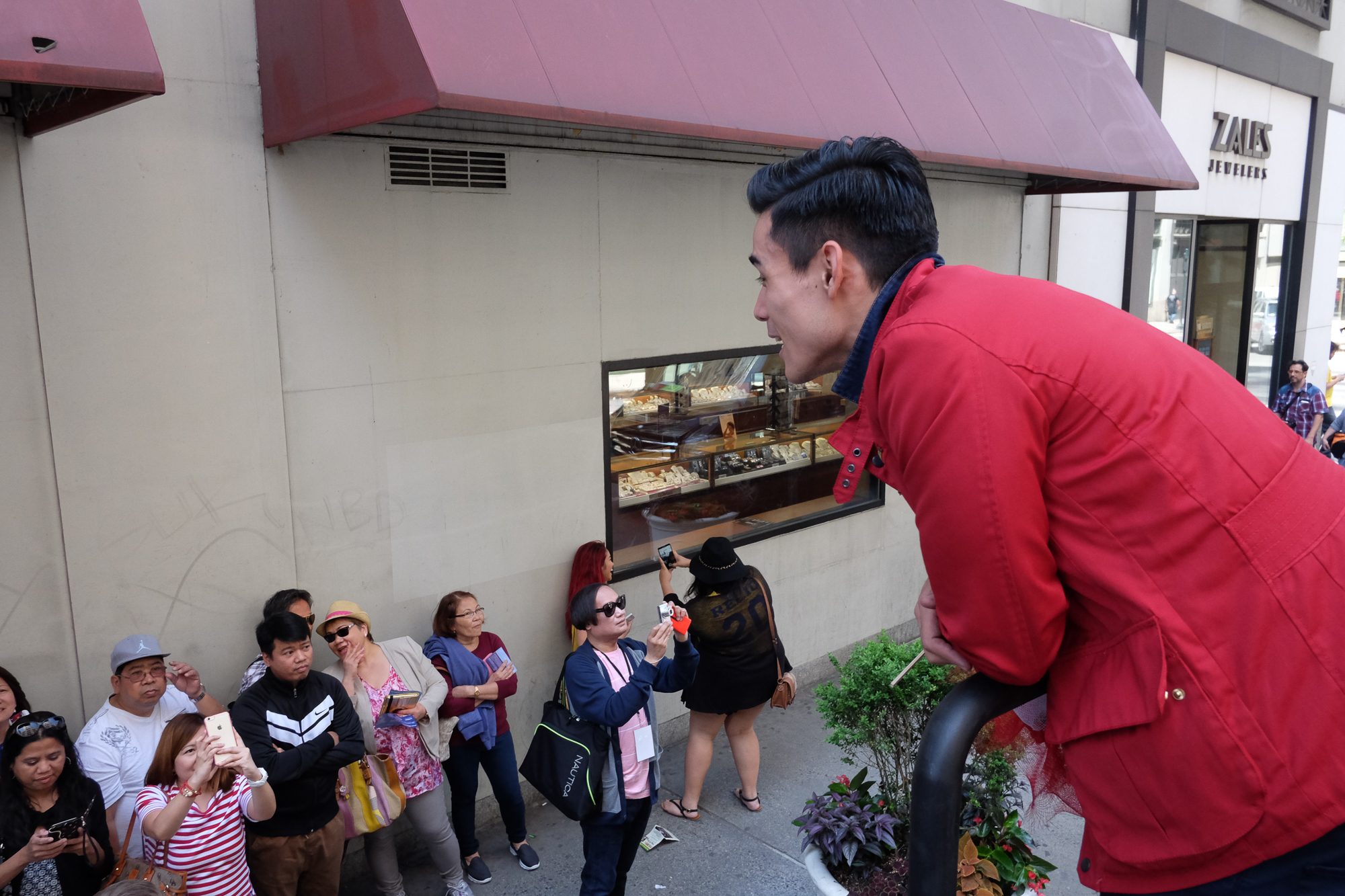 TV STAR. Philippine actor Xian Lim greets fans along Madison Avenue.  