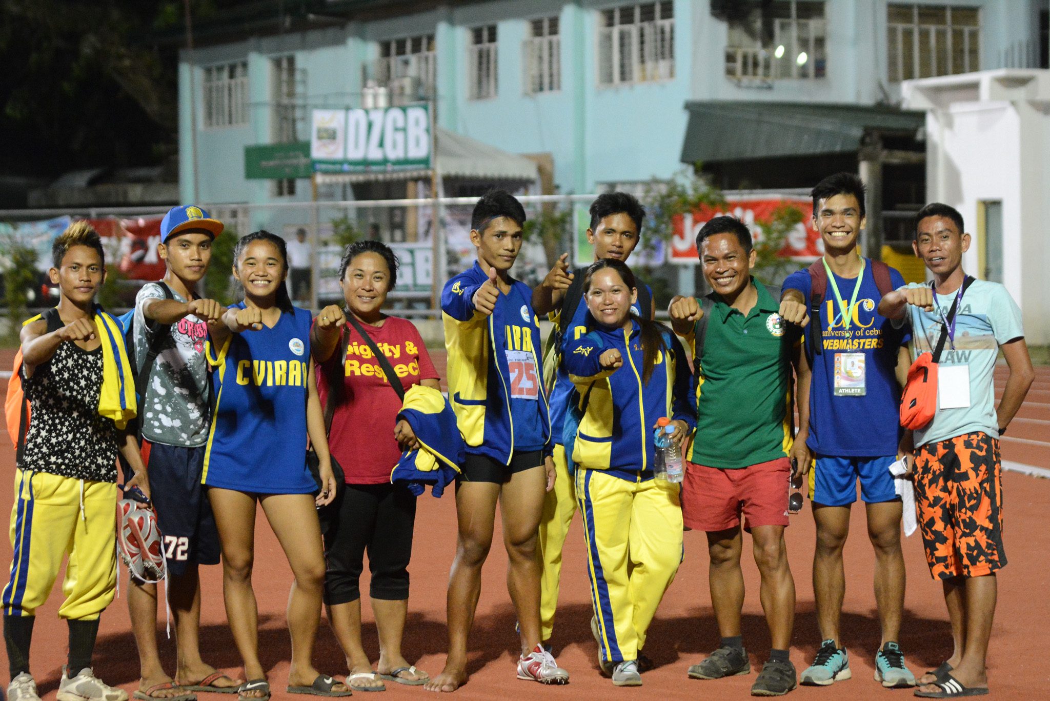 SMILE. Secondary boys high jump gold medalist Engelbert Avenido from Central Visayas with his teammates and coaches. Photo by Roy Secretario/ Rappler 