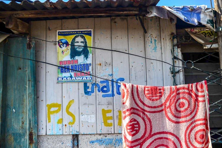 ALL AROUND. A poster of Ben Kristo running as garangay kagawad is seen on one of the houses in Purok 6, San Pedro Cutud.   