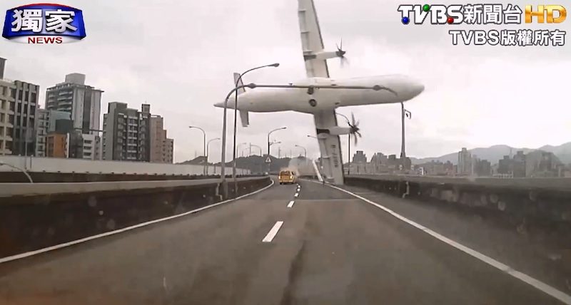 CLIPPED. A video grabbed image made available by visual courtesy to TVBS Taiwan showing a TransAsia Airways passenger plane seen shortly before it crashed into the Keelung River in Taipei, Taiwan, 04 February 2015.  