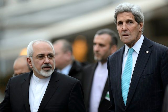In this file photo, US Secretary of State John Kerry, (R), speaks with Iranian Foreign Minister Mohammad Javad Zarif, (L), as they walk in the city of Geneva, Switzerland, 14 January 2015. Laurent Gillieron/EPA 
