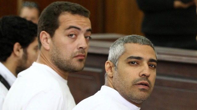 Egypt frees Al Jazeera reporters pending retrial