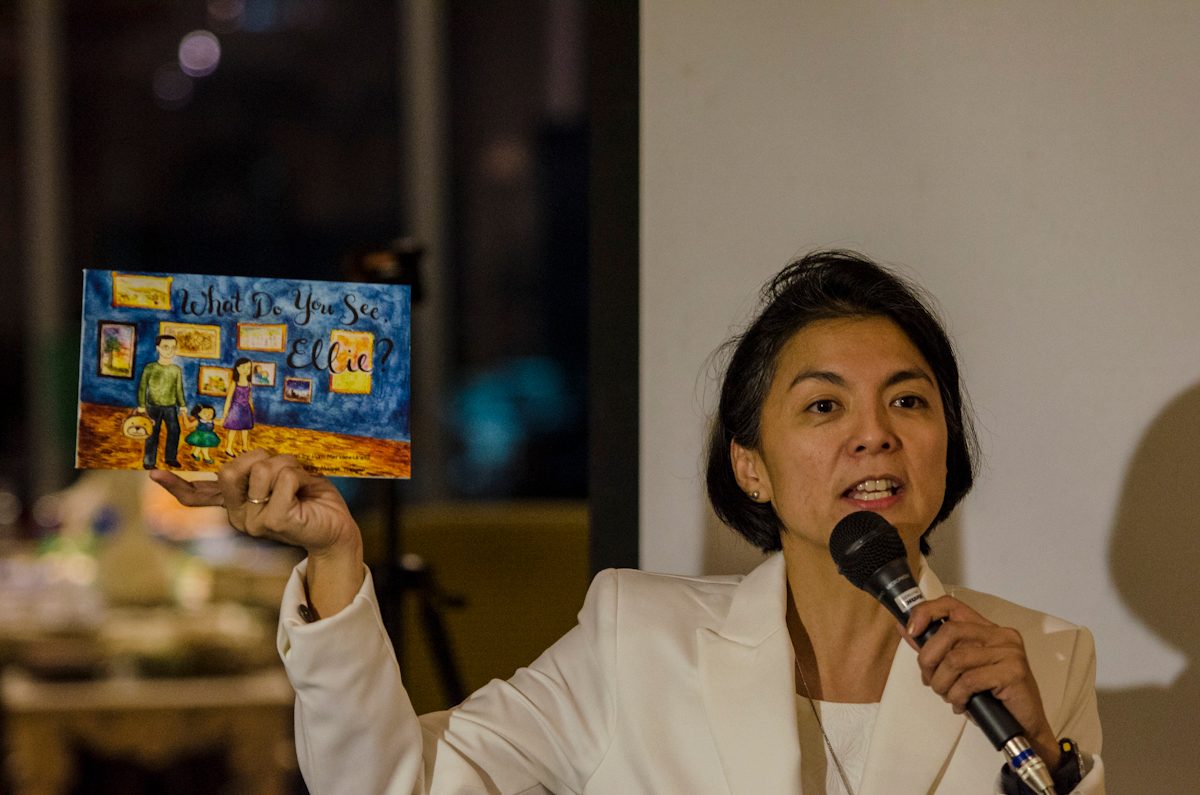 LOVE FOR READING. Esther Lingao, holds a copy of the book ' What Do You See Ellie,' one of two books launched during the Sunday+Light Bearer Group launch. 