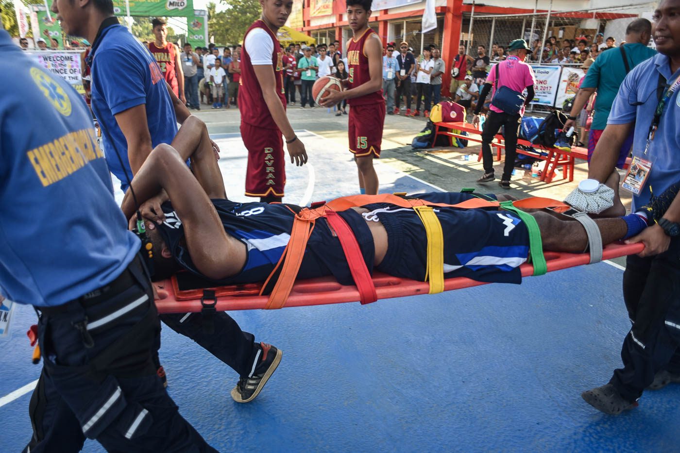 OUCH. Medical team carry Western Visayas cager Ryan Calama-an after injuring his ankle in a game they won against Central Luzon. Photo by LeAnne Jazul/Rappler  