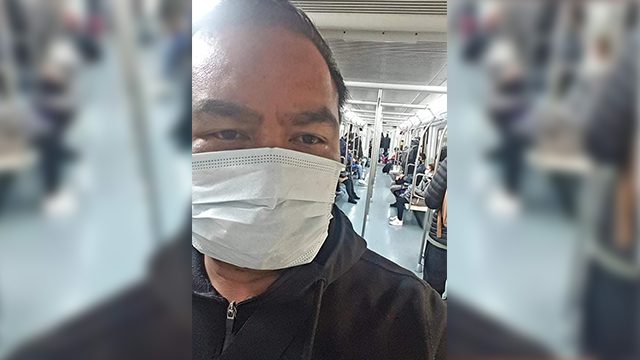 IN TRANSIT. Rhoderick Ople wears a face mask while riding a train in Italy. Photo courtesy of Rhoderick Ople
 