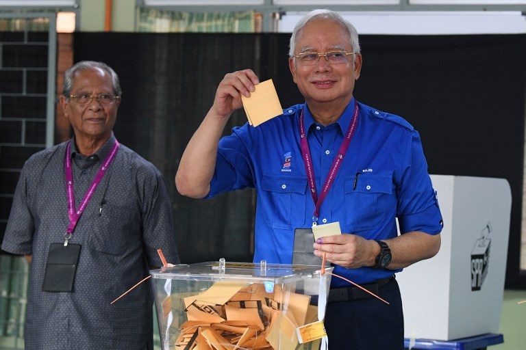 Malaysia’s scandal-mired Najib hit with travel ban after poll loss