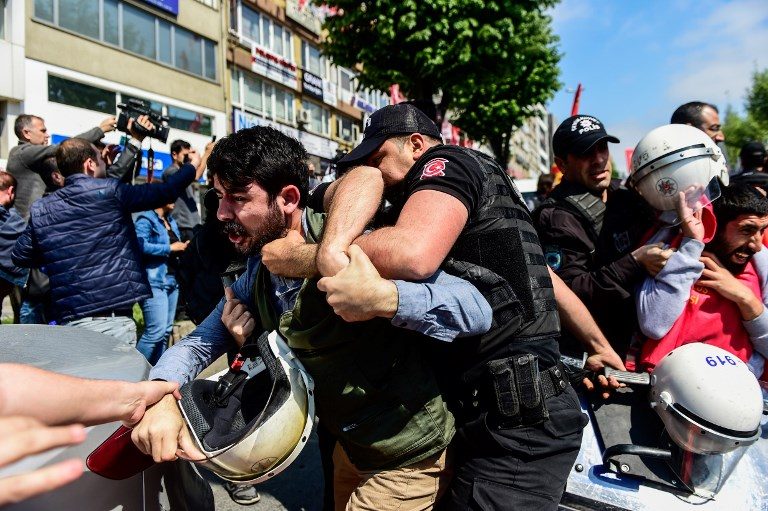 ARRESTS. Turkish police officers arrest protesters attempting to defy a ban and march on Taksim Square to celebrate May Day on May 1, 2018 in Istanbul. Photo by Yasin Akgul/AFP 