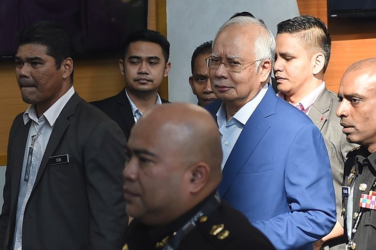 Malaysia’s Najib quizzed over scandal, graft fighter reveals threats