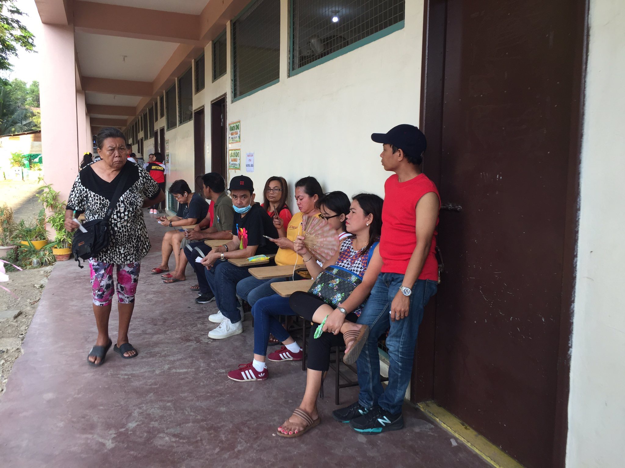 CEBU CITY. Voters at the Tisa II Elementary School in Cebu are given priority numbers and asked to sit at the designated waiting area. Photo by Micole Tizon/Rappler  