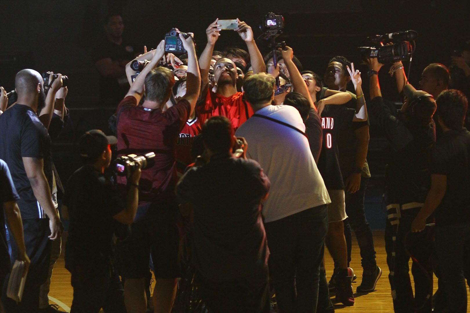 SELFIE TIME. The Trail Blazers star stops to take an image with some fans. Photo by Josh Albelda/ Rappler 
