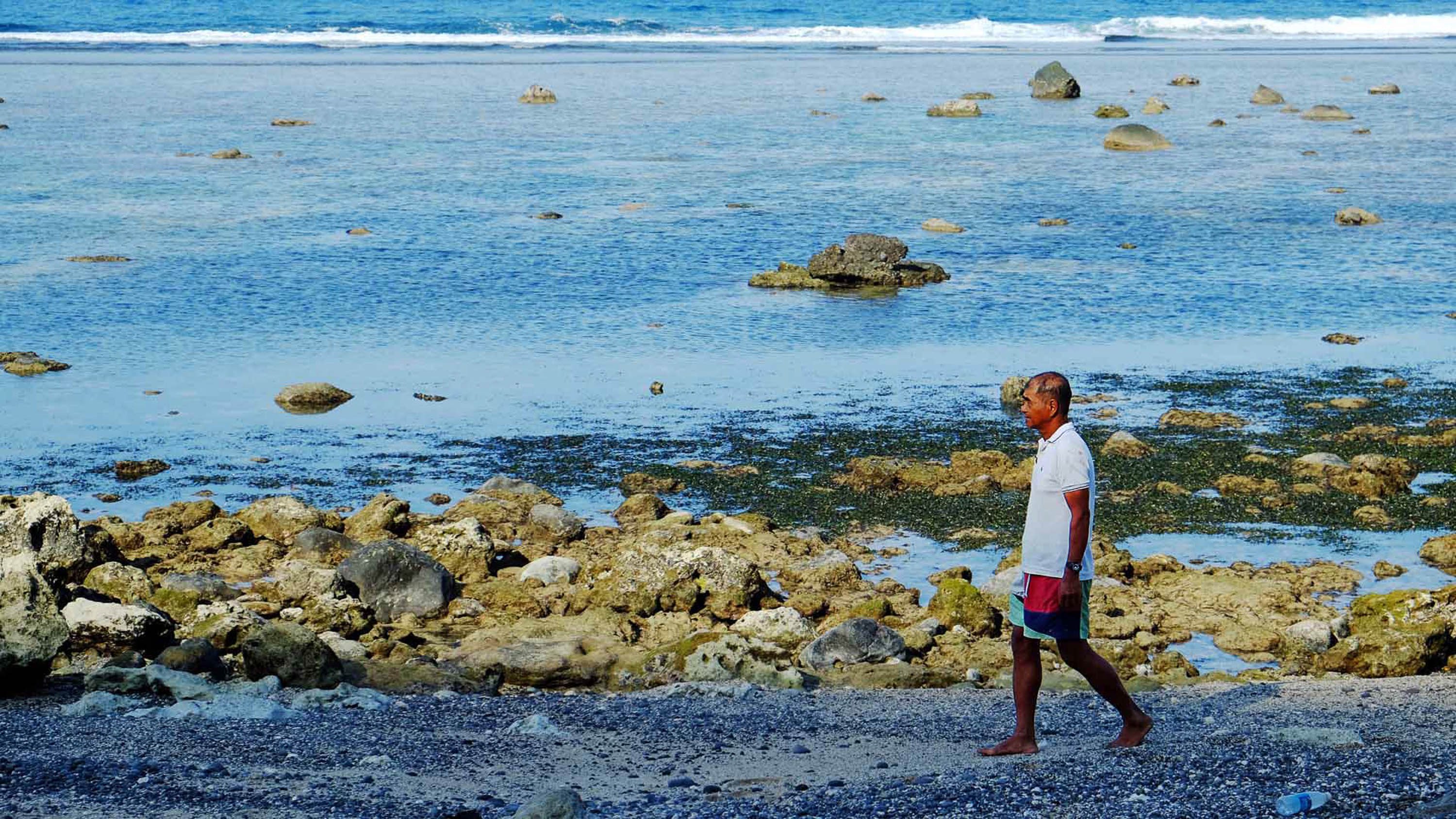 SHAMAN. Uncle Ernie surveying the shores of Diura for the kapayvanuvanua. Photo by Potpot Pinili/Rappler 