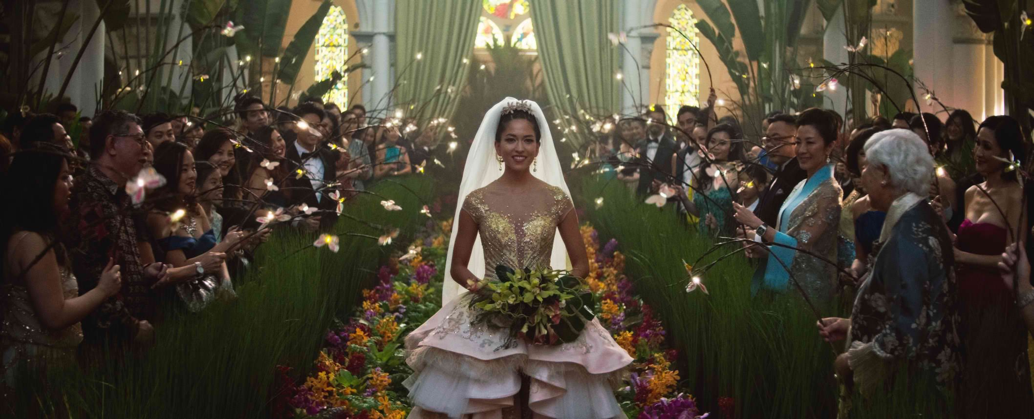 WEDDING OF THE YEAR. Araminta Lee walks down the aisle of the chapel at CHIJMES, now called CHIJMES Hall, a function space that was elaborately decorated for the movie. Photo courtesy of Warner Bros Pictures
 