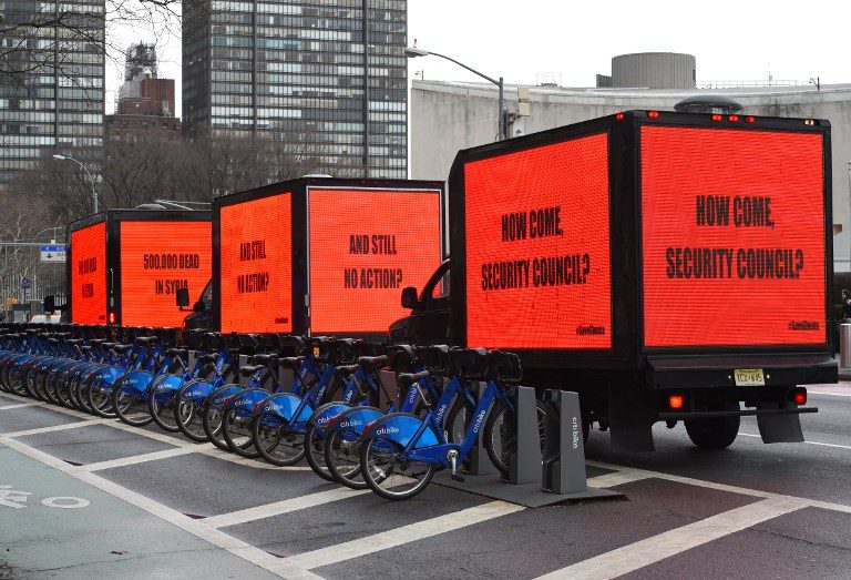 BILLBOARD CALL. Inspired by the Oscar-nominated film 'Three Billboards Outside Ebbing, Missouri,' 3 billboards circle the United Nations on February 22, 2018, for 3 hours to demand action on Syria in ahead of a Security Council vote in New York. Photo by Timothy Clary/AFP 