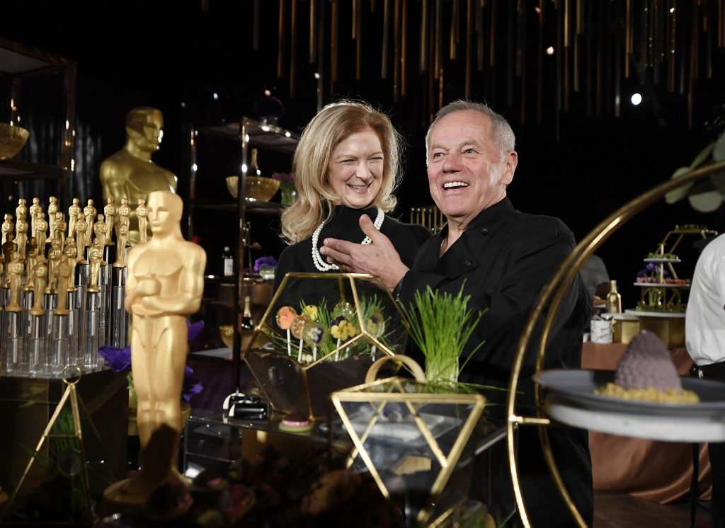 FOOD PREVIEW. Dawn Hudson, Chief Executive Officer of the Academy of Motion Picture Arts and Sciences, and Wolfgang Puck pose during the Governors Ball press preview for the 92nd Annual Academy Awards on January 31, 2020 in Los Angeles, California.  Photo by  Kevork Djansezian/Getty Images/AFP 