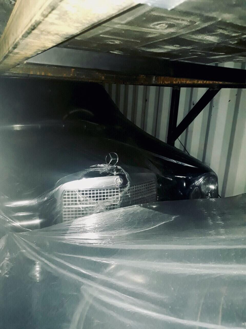 DISCOVERY. A Mercedes Benz is packed with 3 other luxury vehicles in a shipment delcared as only containing a car body part. Photo from Bureau of Customs 