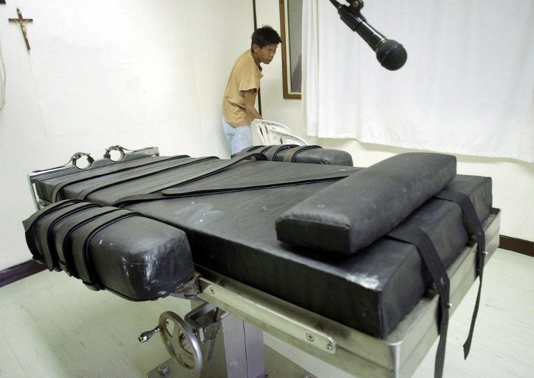 LETHAL INJECTION CHAMBER. An inmate prepares the lethal injection chamber at the New Bilibid Prison in Muntinlupa on January 9, 2004, two years before former President Gloria Macapagal-Arroyo abolished the capital punishment in the country. File photo by Joel Nito/AFP 